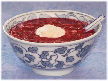A bowl of borscht with seed cheese